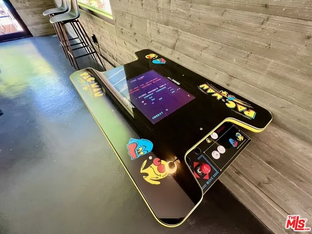 a bed room with furniture and a large window