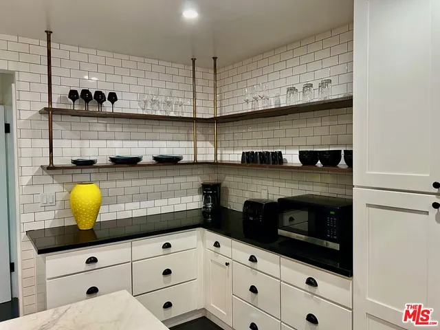 a view of swimming pool with a patio