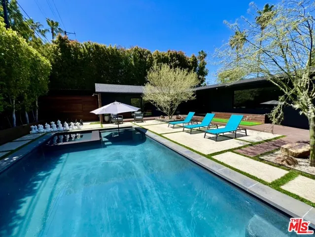 a view of a chairs and table in the patio