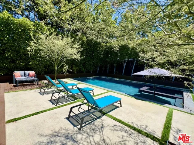 a view of a swimming pool with a patio