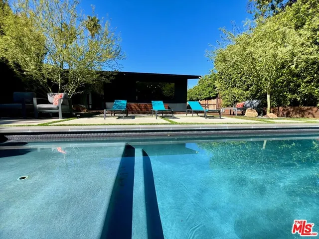 a view of a dining room with furniture and window