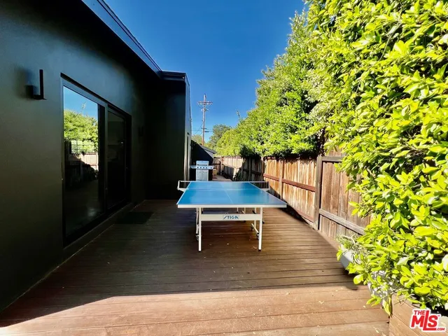 a living room with a couch and a floor to ceiling window