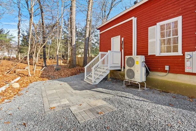 a view of a patio with a chairs and table in the patio