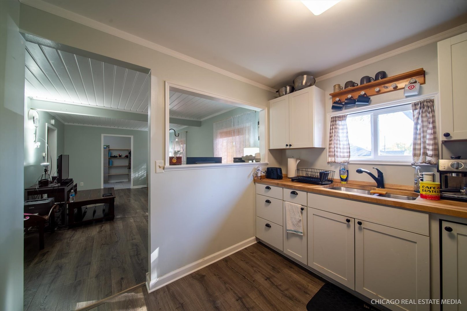 945 South 7th Street DeKalb, IL 60115 - Photo 12 of 18 a kitchen with sink cabinets and wooden floor