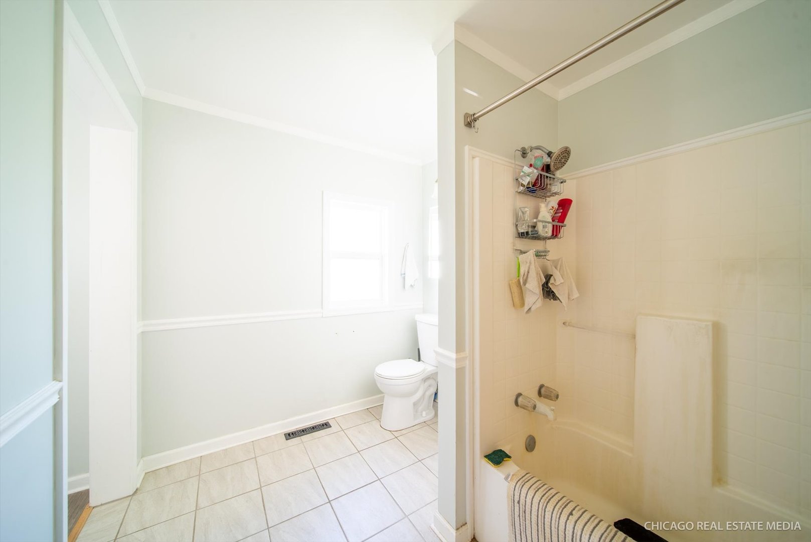 945 South 7th Street DeKalb, IL 60115 - Photo 14 of 18 a bathroom with a toilet and a shower