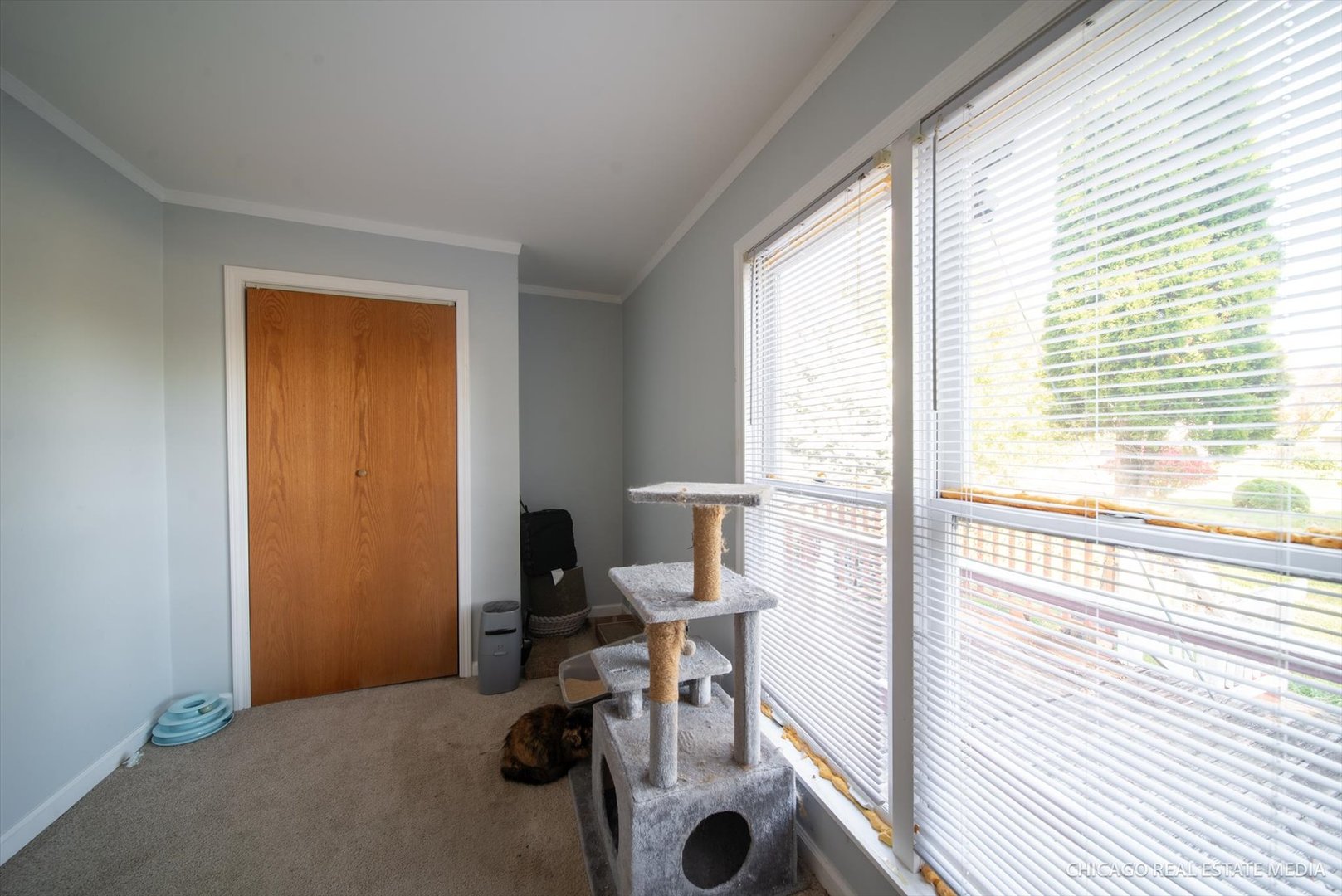 945 South 7th Street DeKalb, IL 60115 - Photo 6 of 18 a view of a workspace with furniture and a window