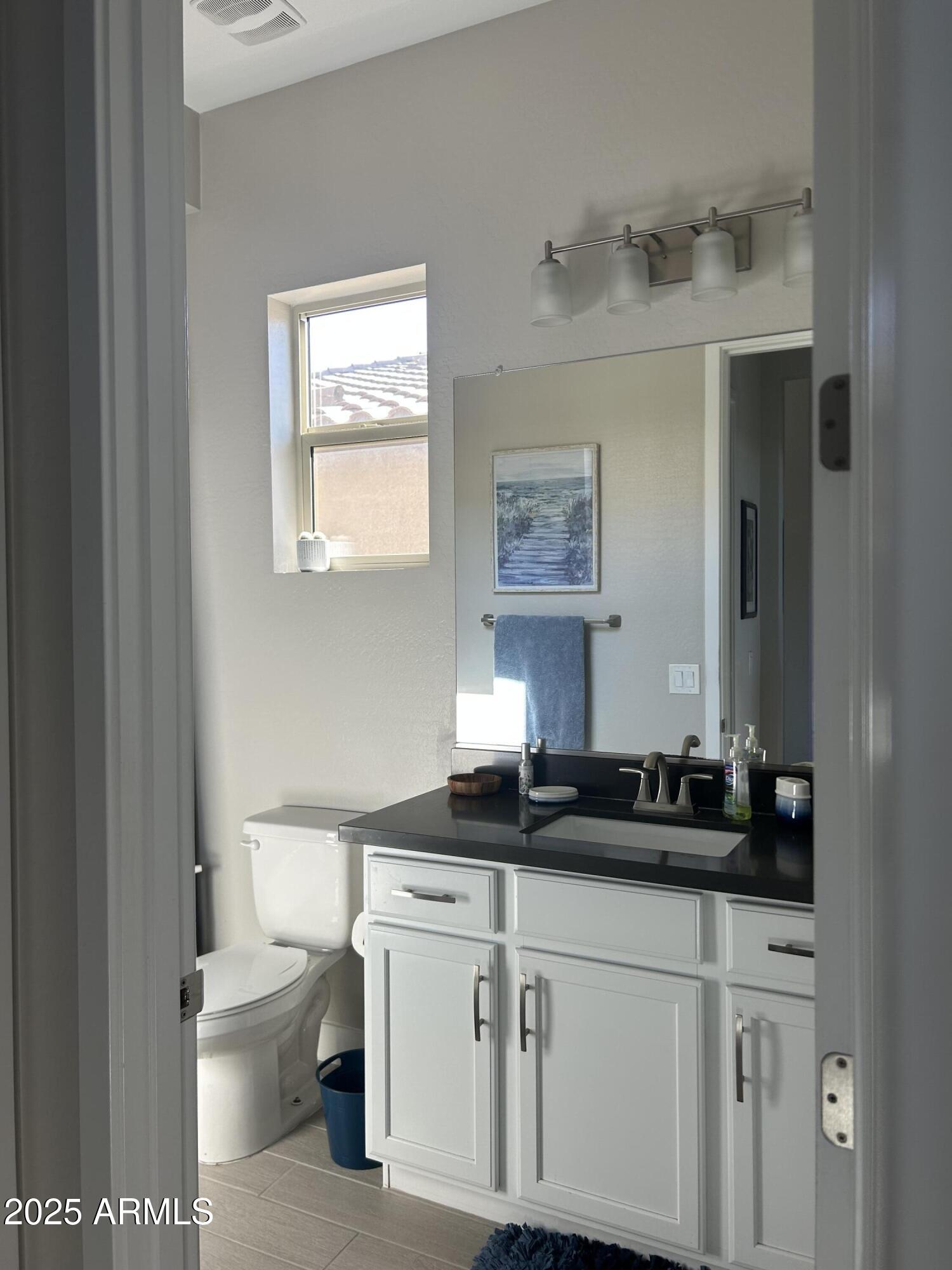 18828 East Blue Sky Drive Rio Verde, AZ 85263 - Photo 14 of 21 a kitchen with a sink and a toilet