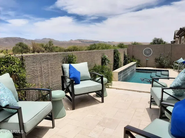 a view of a terrace with wooden benches