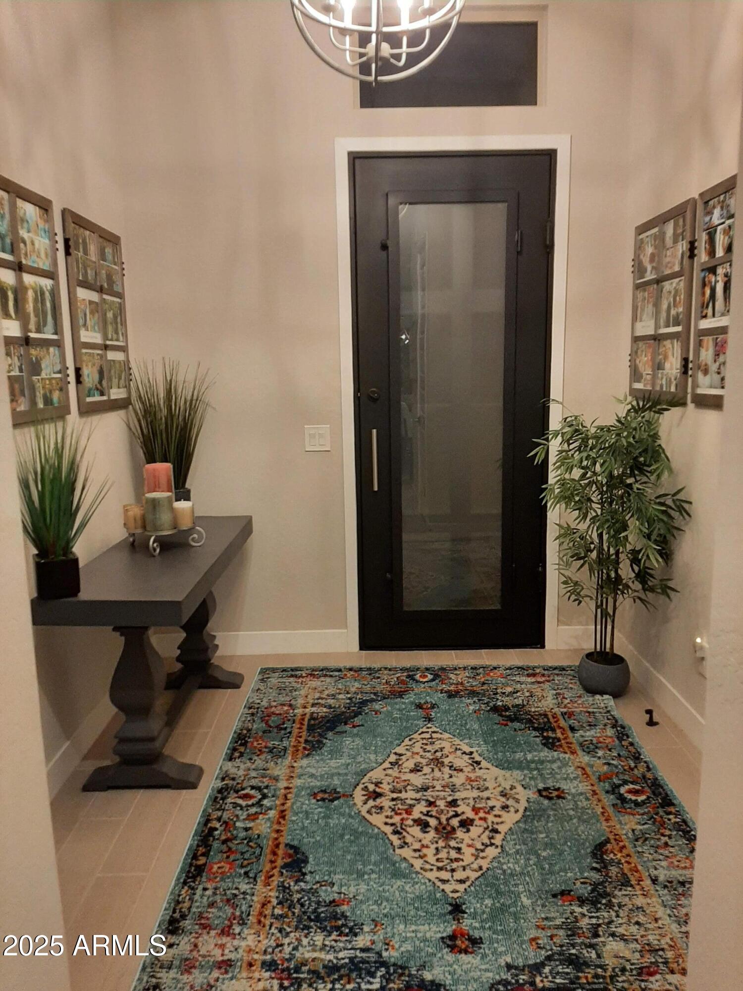 18828 East Blue Sky Drive Rio Verde, AZ 85263 - Photo 2 of 21 a view of a hallway with wooden floor and a potted plant