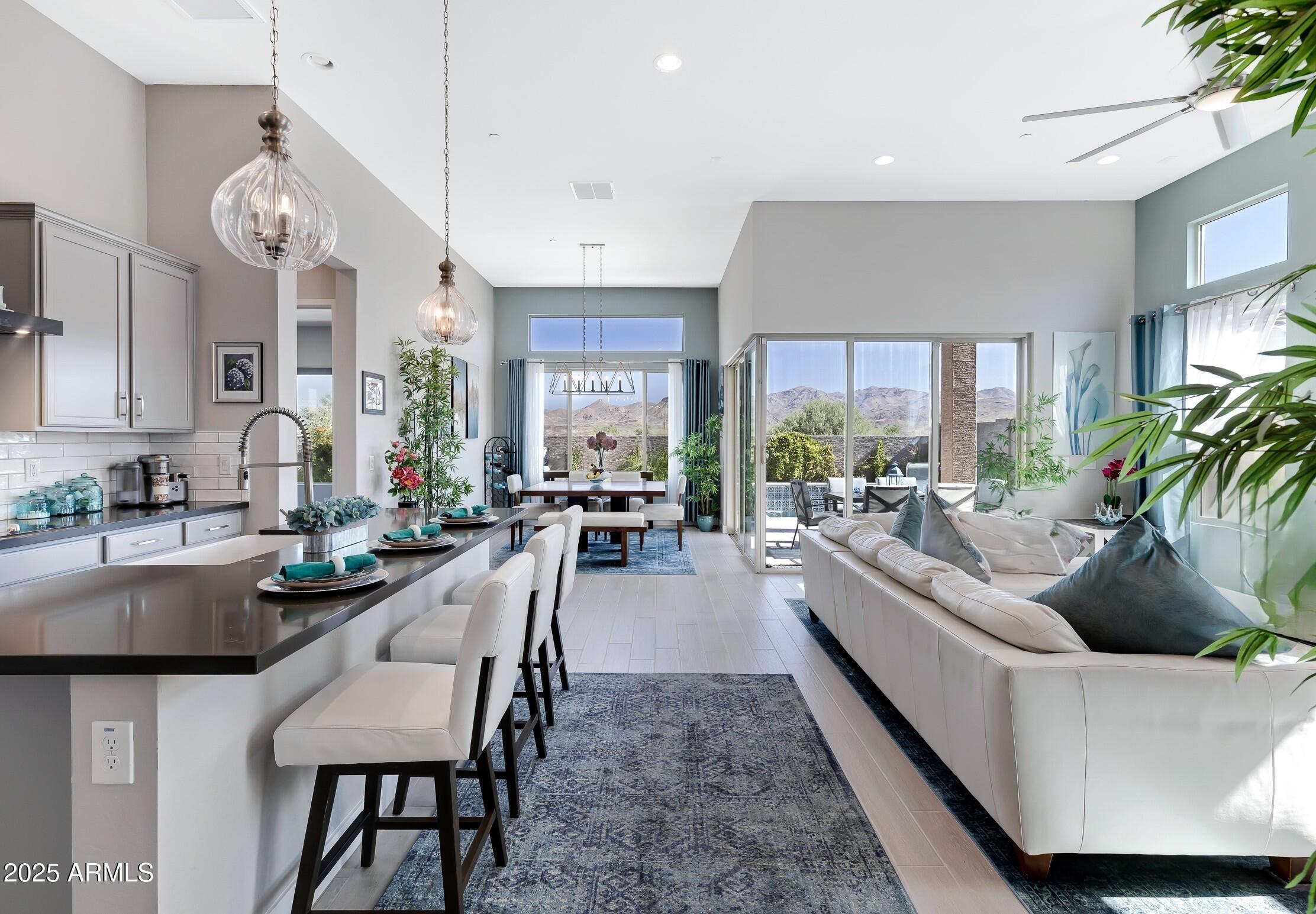 18828 East Blue Sky Drive Rio Verde, AZ 85263 - Photo 7 of 21 a living room with furniture and a large window
