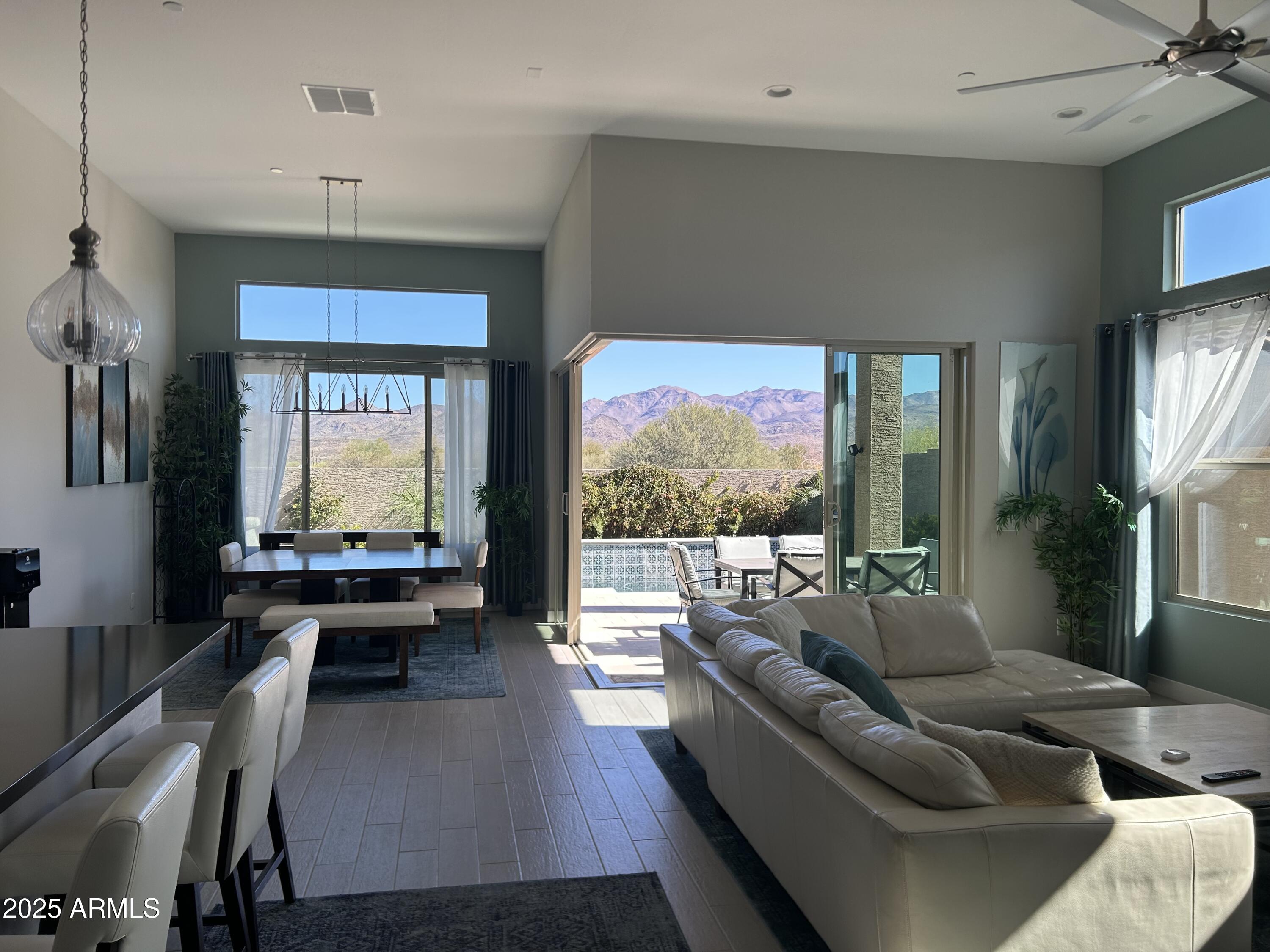 18828 East Blue Sky Drive Rio Verde, AZ 85263 - Photo 8 of 21 a living room with furniture and a large window