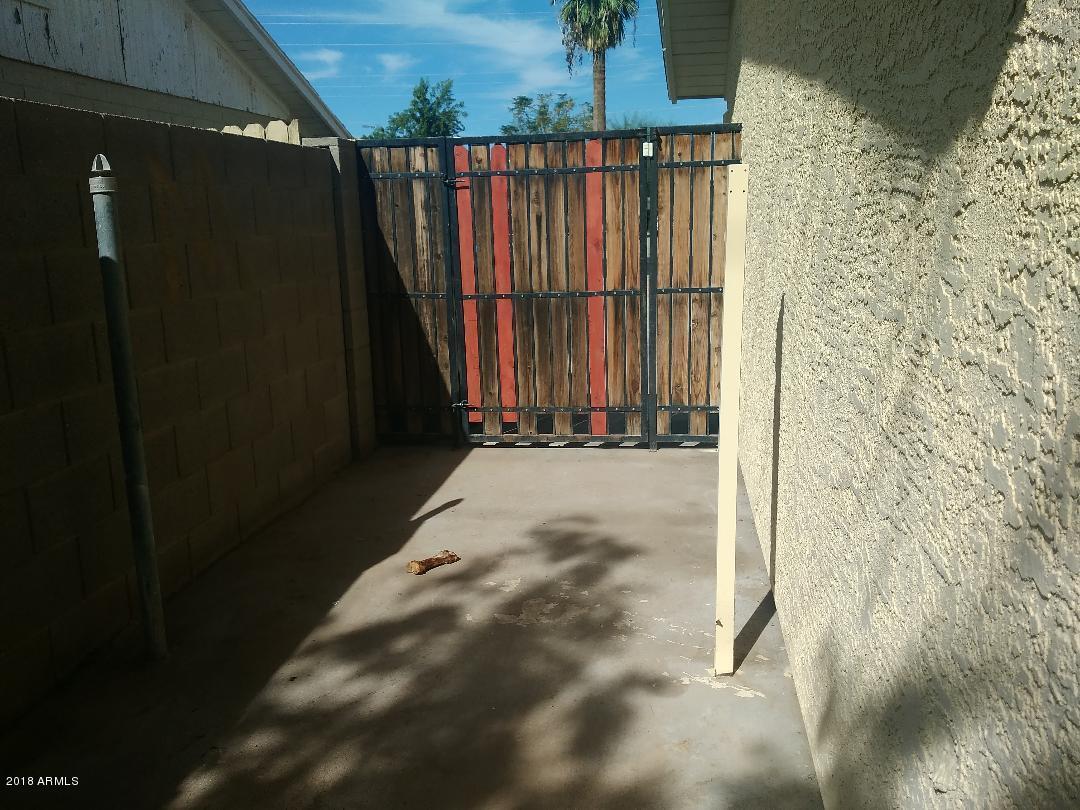 5401 West Osborn Road Phoenix, AZ 85031 - Photo 15 of 18 osborn side yard leading to drive way