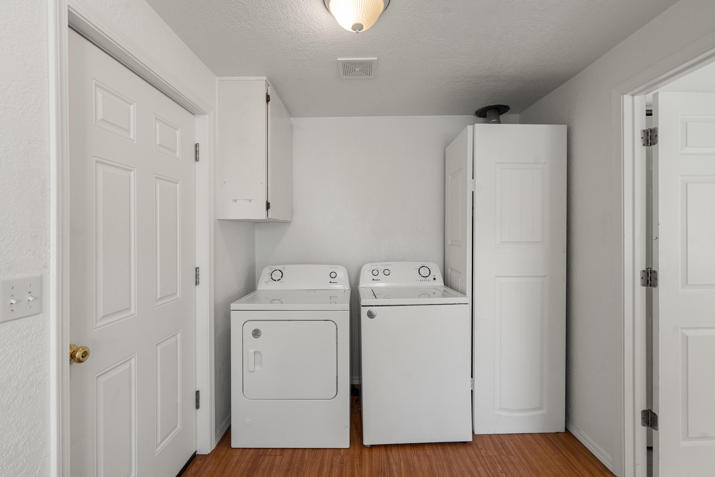 943 Hopkins Road Central Point, OR 97502 - Photo 16 of 21 a view of storage and utility room with washer and dryer