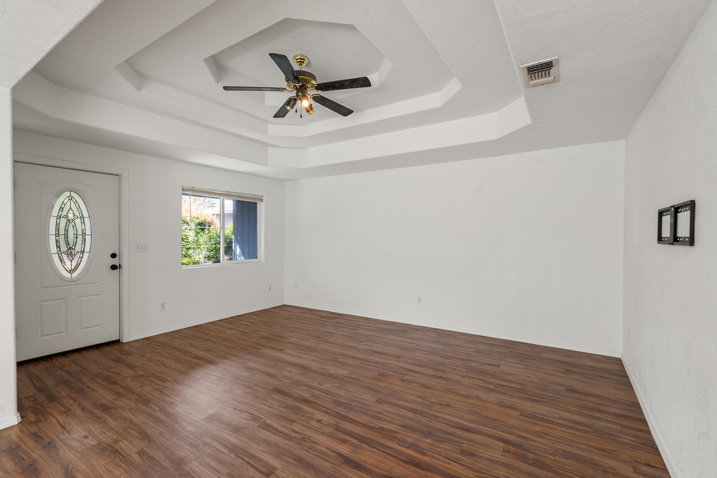 943 Hopkins Road Central Point, OR 97502 - Photo 4 of 21 wooden floor in an empty room with a window