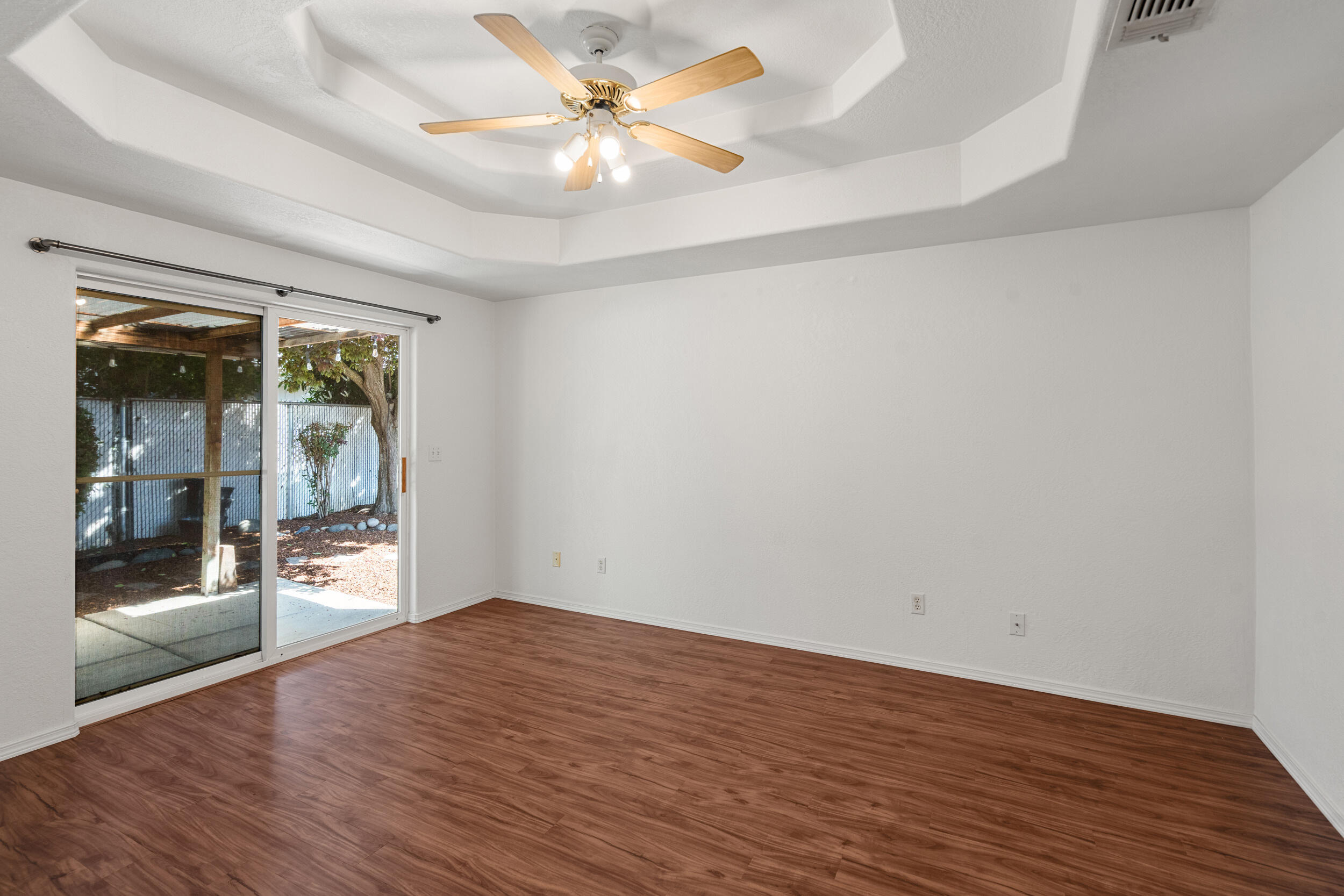 943 Hopkins Road Central Point, OR 97502 - Photo 9 of 21 wooden floor in an empty room with a window