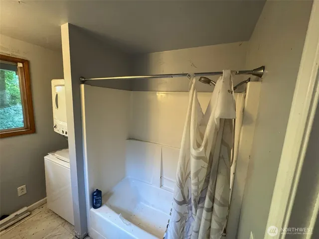 a bathroom with a shower and a toilet