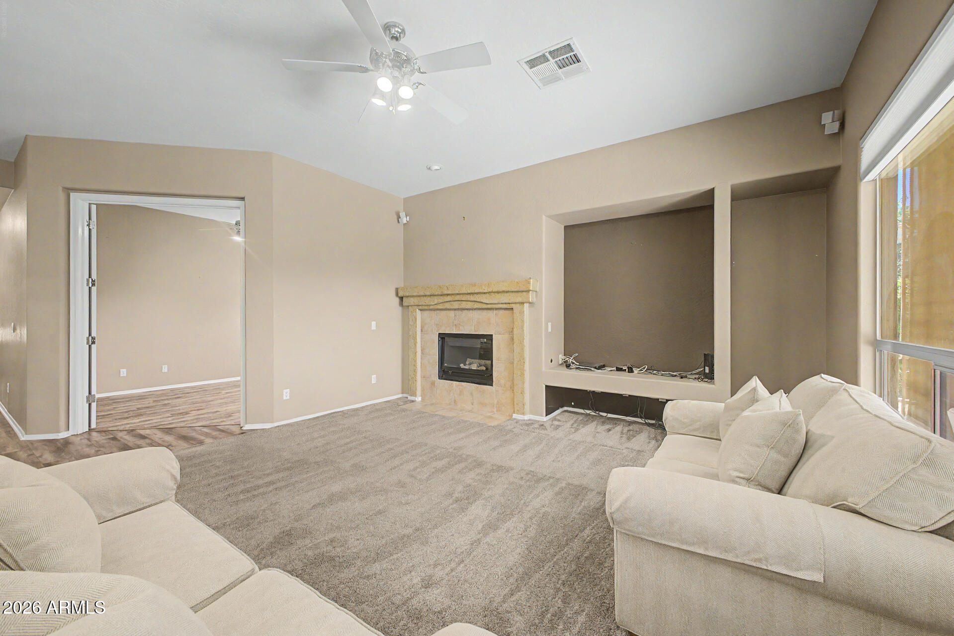 5090 South Ranger Trail Gilbert, AZ 85298 - Photo 7 of 50 a living room with furniture and a fireplace