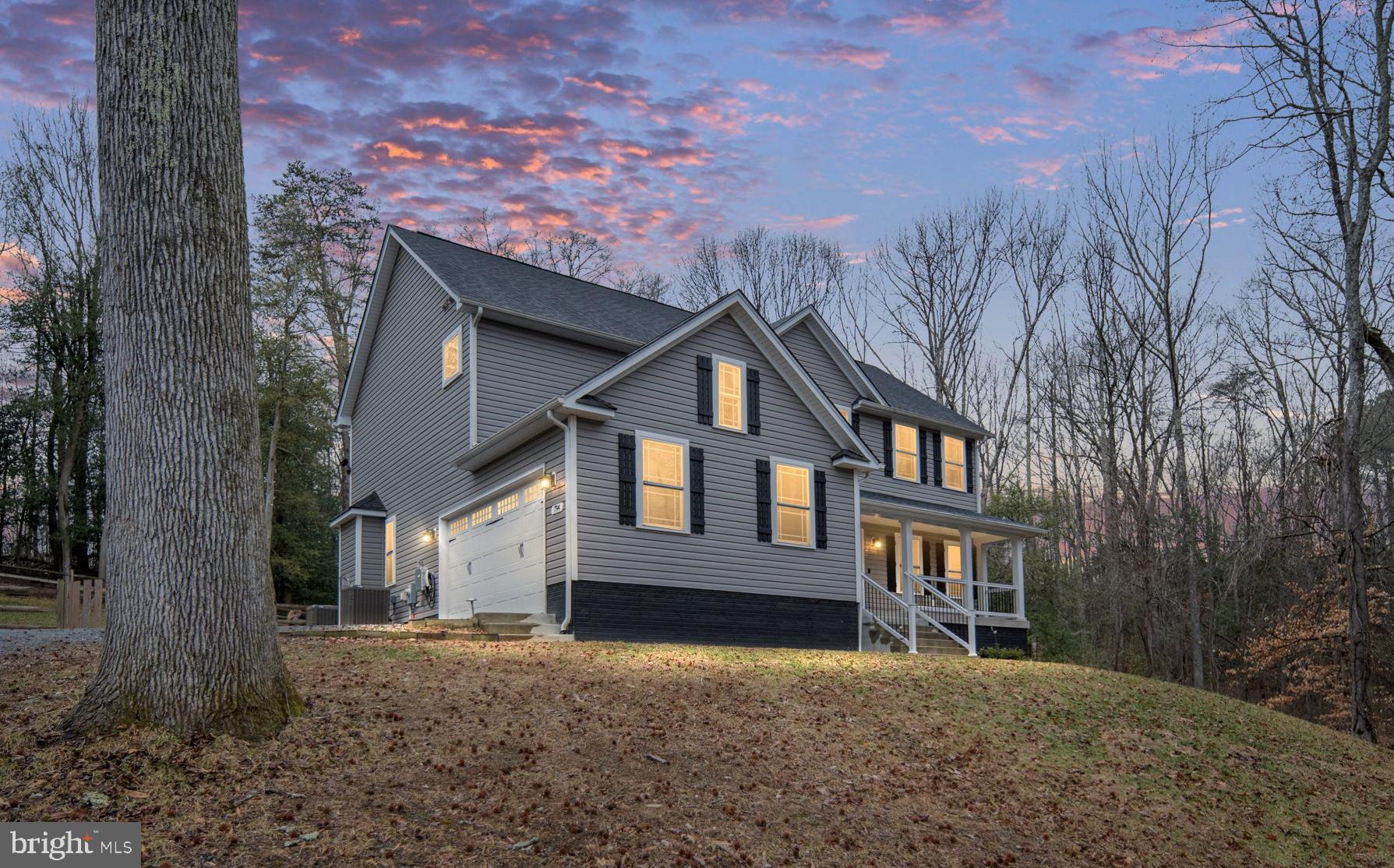 794 White Oak Road Fredericksburg, VA 22405 - Photo 1 of 70 a front view of a house with a yard