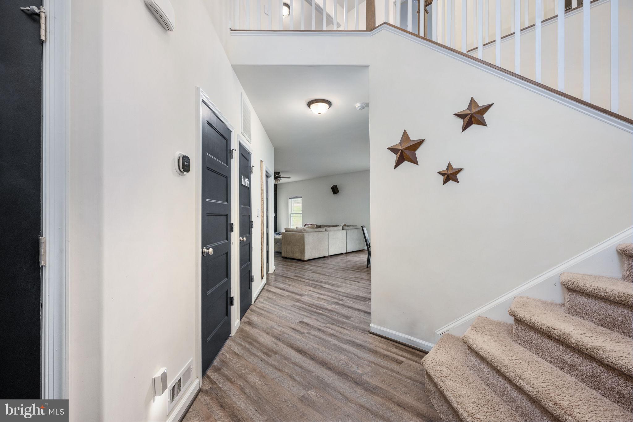 794 White Oak Road Fredericksburg, VA 22405 - Photo 13 of 70 a view of a hallway with wooden floor and staircase