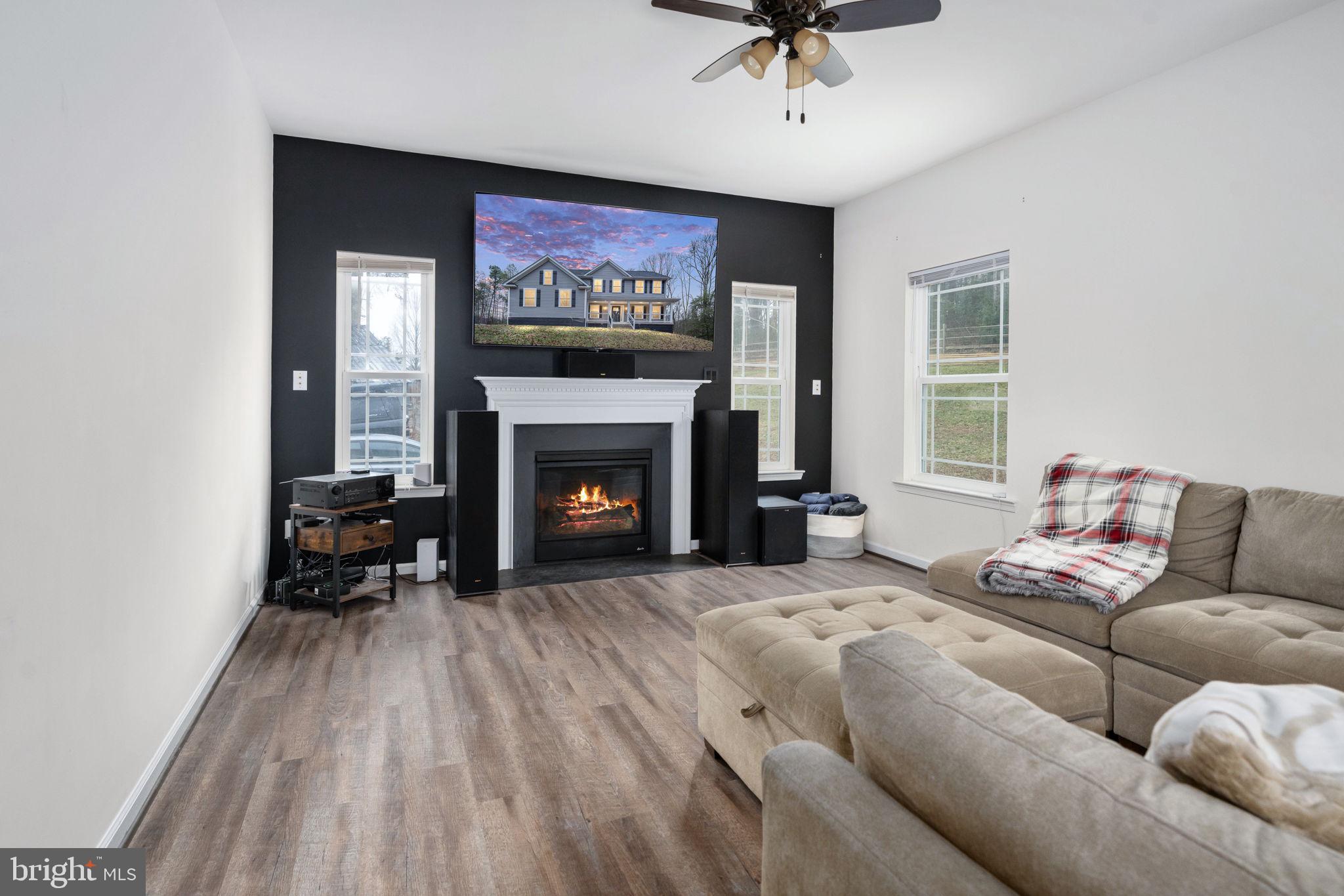 794 White Oak Road Fredericksburg, VA 22405 - Photo 14 of 70 a living room with furniture and a fireplace