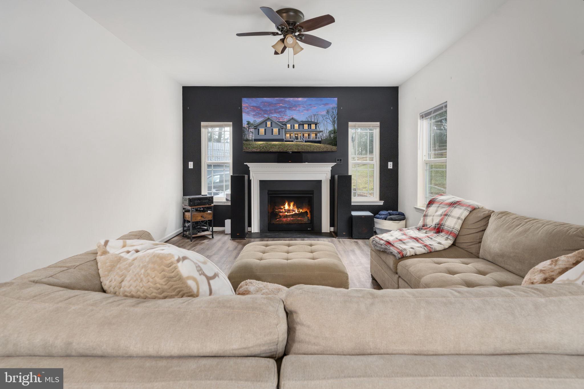 794 White Oak Road Fredericksburg, VA 22405 - Photo 15 of 70 a living room with furniture and a fireplace