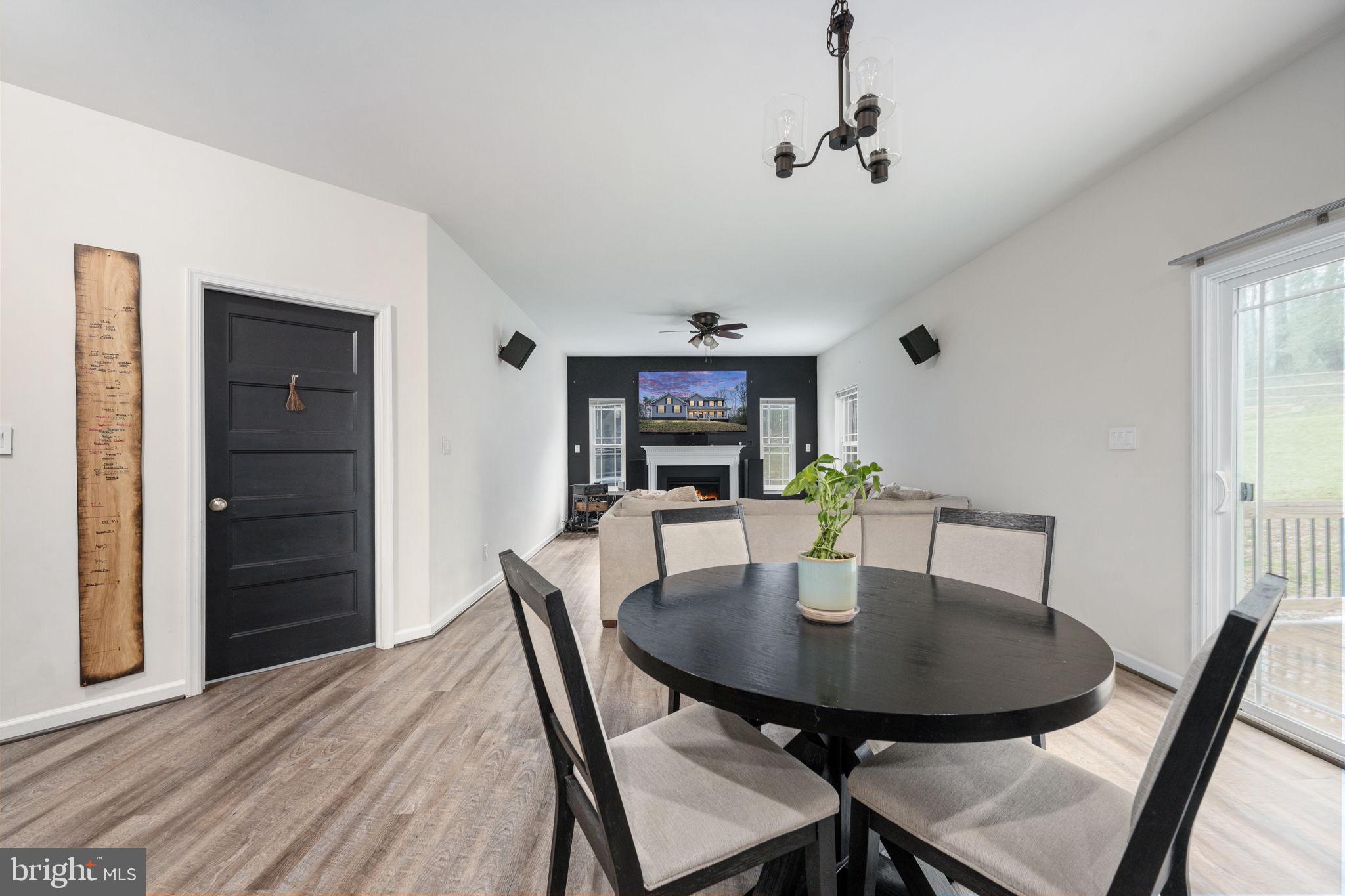 794 White Oak Road Fredericksburg, VA 22405 - Photo 18 of 70 a view of a dining room with furniture and wooden floor