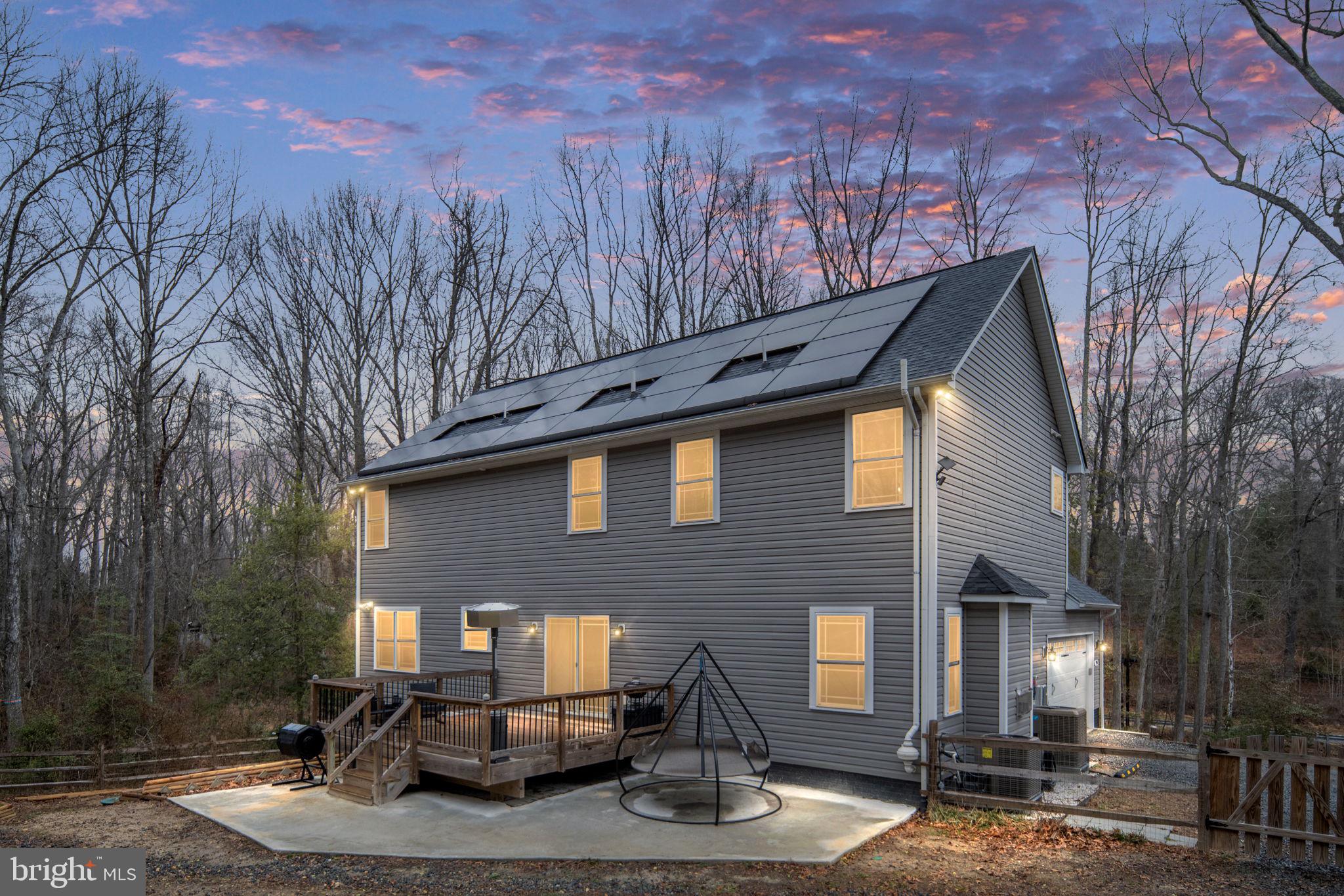 794 White Oak Road Fredericksburg, VA 22405 - Photo 2 of 70 a front view of a house with basket ball court and outdoor seating