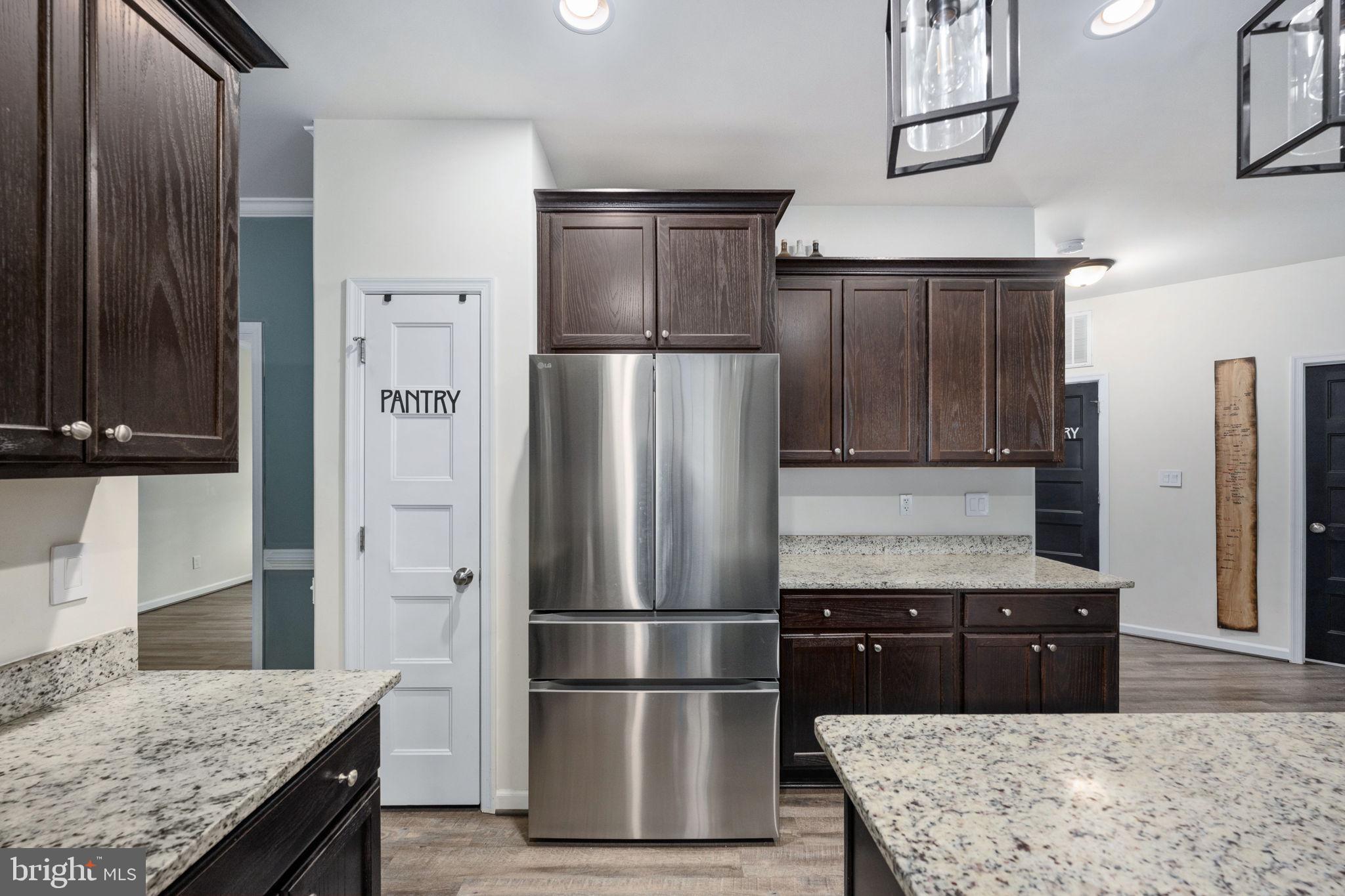 794 White Oak Road Fredericksburg, VA 22405 - Photo 23 of 70 a kitchen with stainless steel appliances granite countertop a refrigerator and a stove top oven