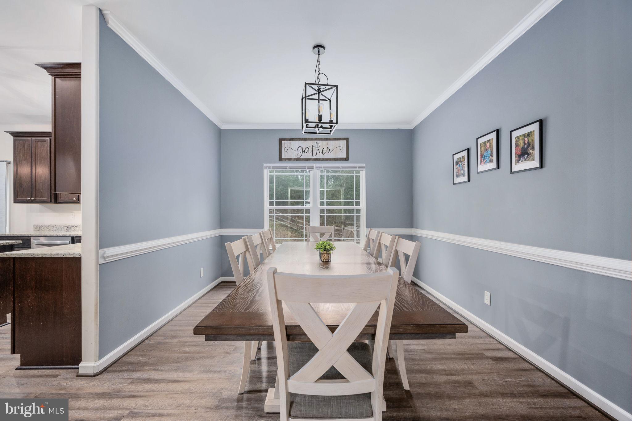 794 White Oak Road Fredericksburg, VA 22405 - Photo 24 of 70 a view of a dining room with furniture window and wooden floor