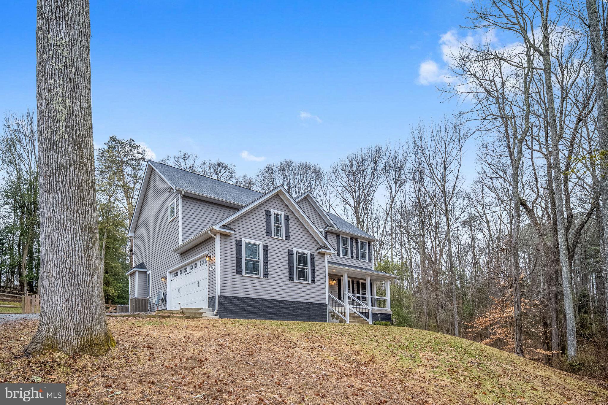 794 White Oak Road Fredericksburg, VA 22405 - Photo 3 of 70 a front view of a house with a yard