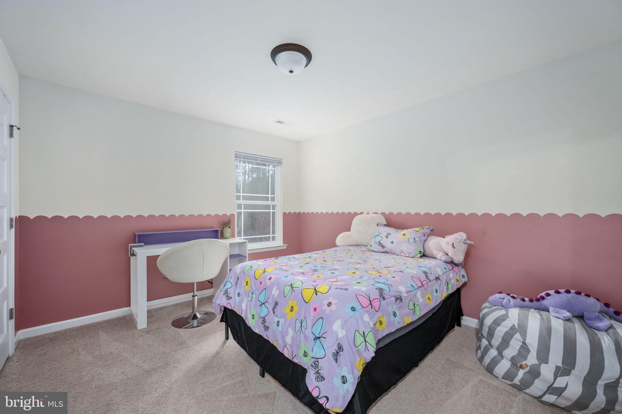 794 White Oak Road Fredericksburg, VA 22405 - Photo 34 of 70 a bedroom with a bed and a chair