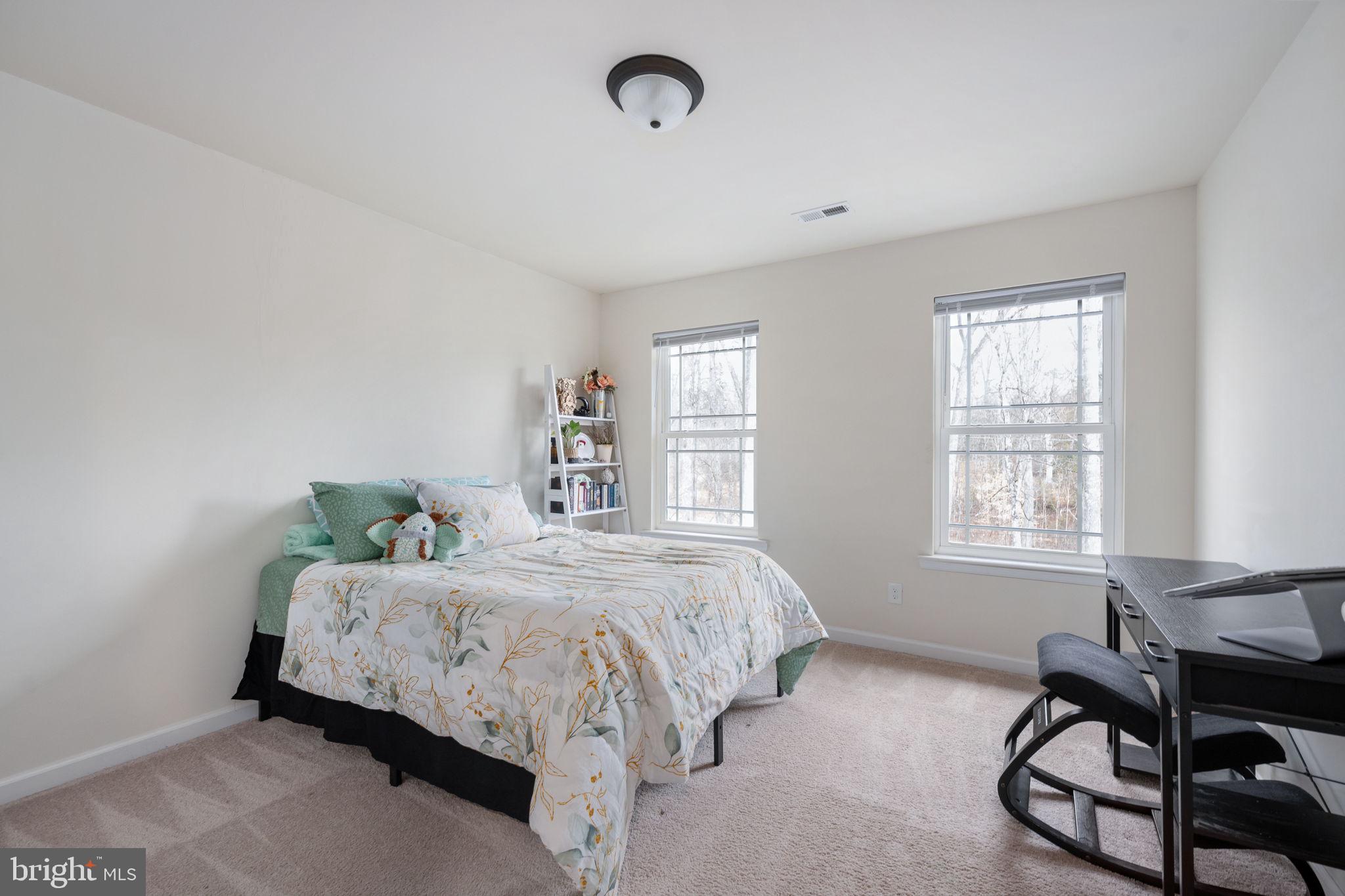 794 White Oak Road Fredericksburg, VA 22405 - Photo 35 of 70 a bedroom with a bed chair and a window