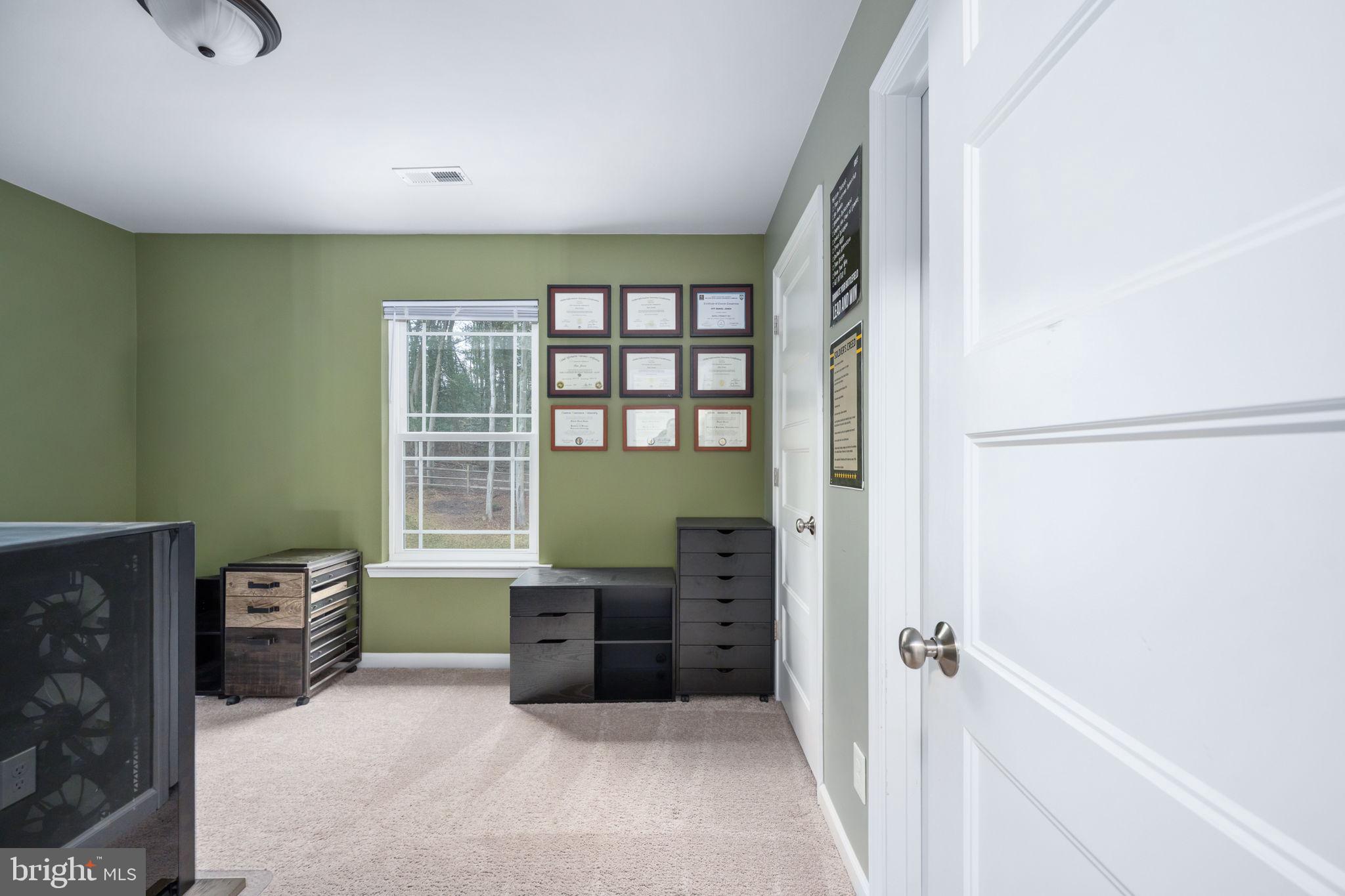 794 White Oak Road Fredericksburg, VA 22405 - Photo 39 of 70 a room with furniture and a window