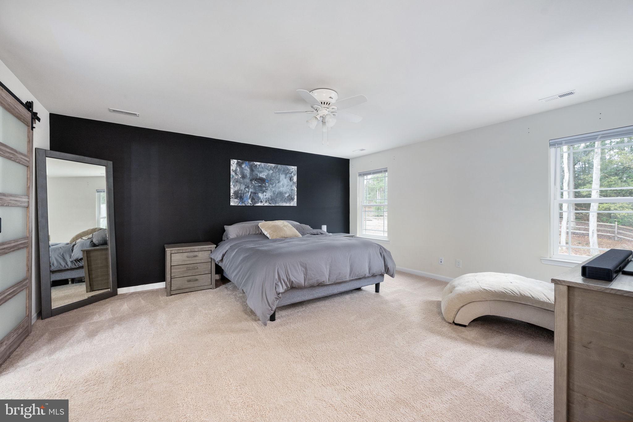 794 White Oak Road Fredericksburg, VA 22405 - Photo 41 of 70 a spacious bedroom with a bed and a window