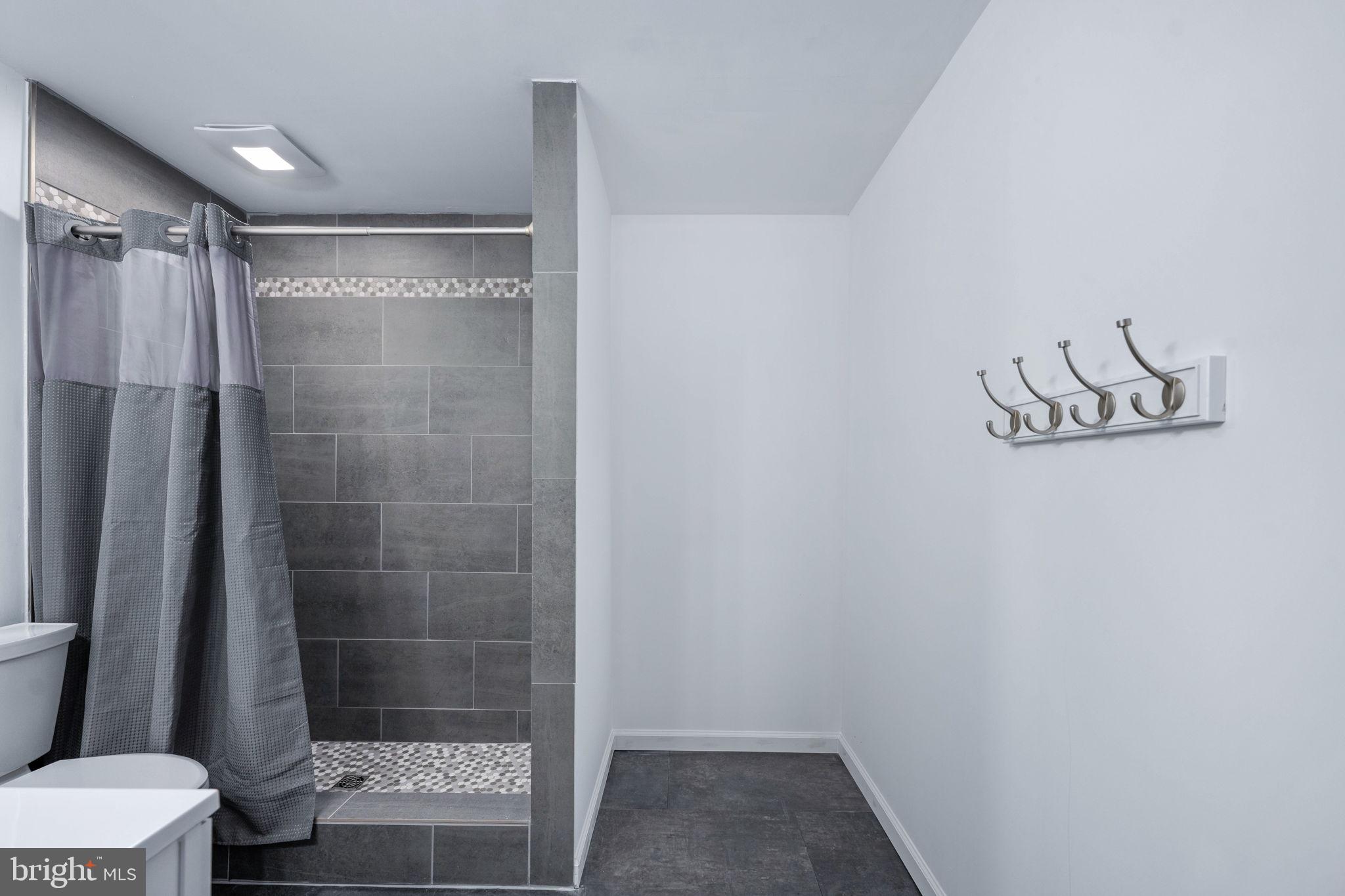 794 White Oak Road Fredericksburg, VA 22405 - Photo 53 of 70 a bathroom with a shower and a toilet