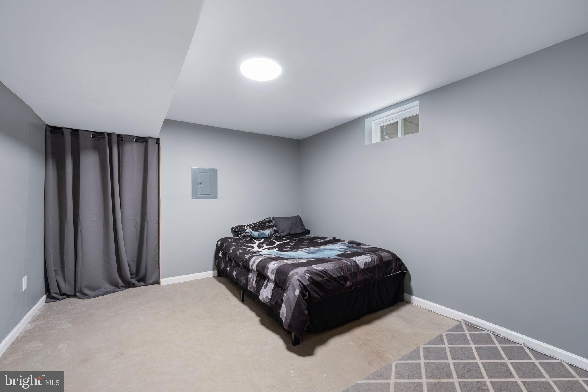 794 White Oak Road Fredericksburg, VA 22405 - Photo 54 of 70 a bedroom with a bed and a window