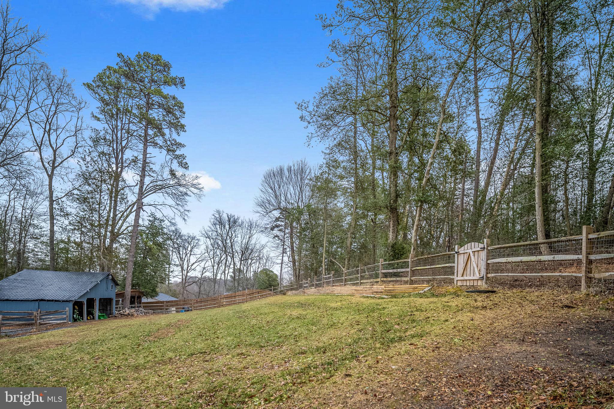 794 White Oak Road Fredericksburg, VA 22405 - Photo 58 of 70 a backyard of a house with table and chairs