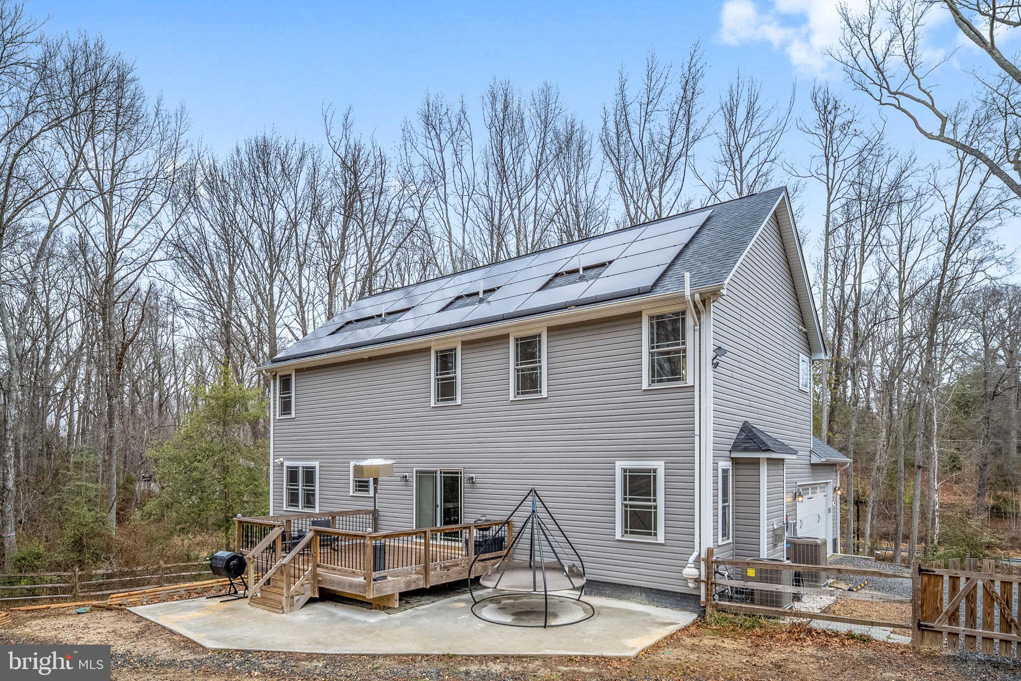 794 White Oak Road Fredericksburg, VA 22405 - Photo 61 of 70 a backyard of a house with yard fire pit and outdoor seating