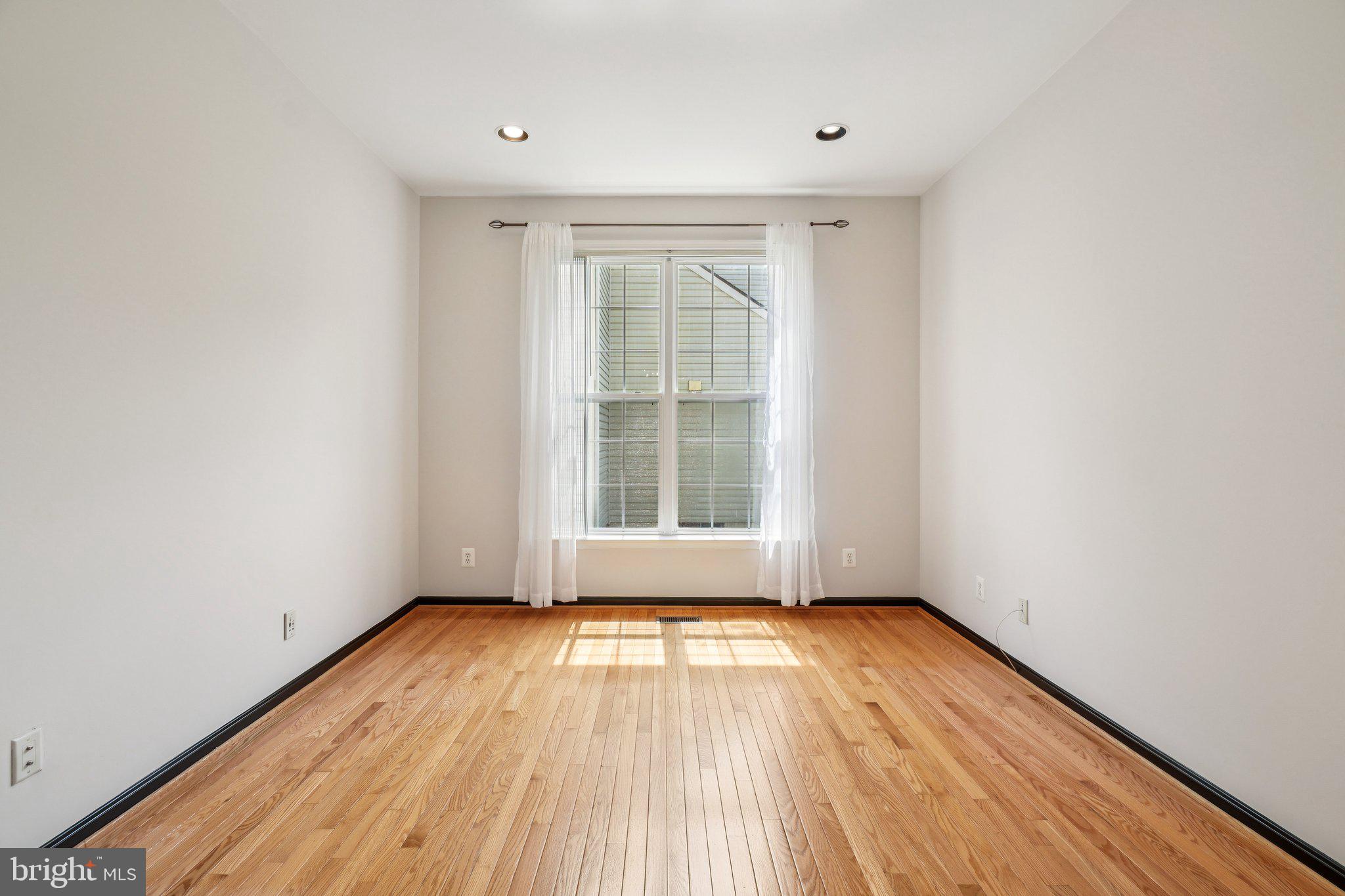 12513 Fox View Way Reston, VA 20191 - Photo 11 of 39 a view of empty room with wooden floor and fan