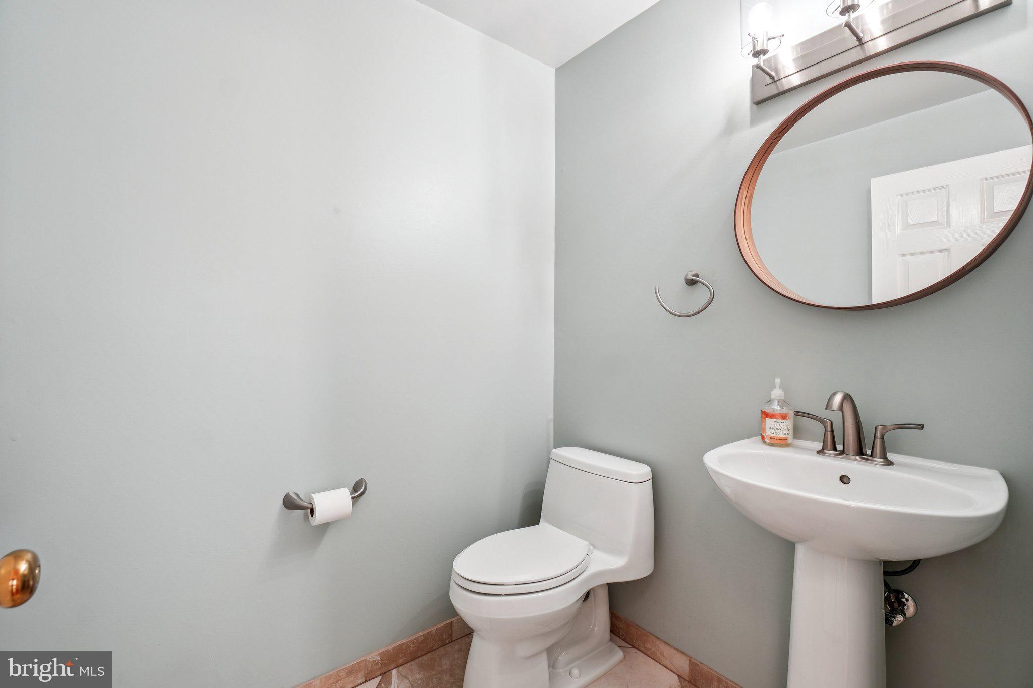 12513 Fox View Way Reston, VA 20191 - Photo 12 of 39 a bathroom with a toilet sink and mirror