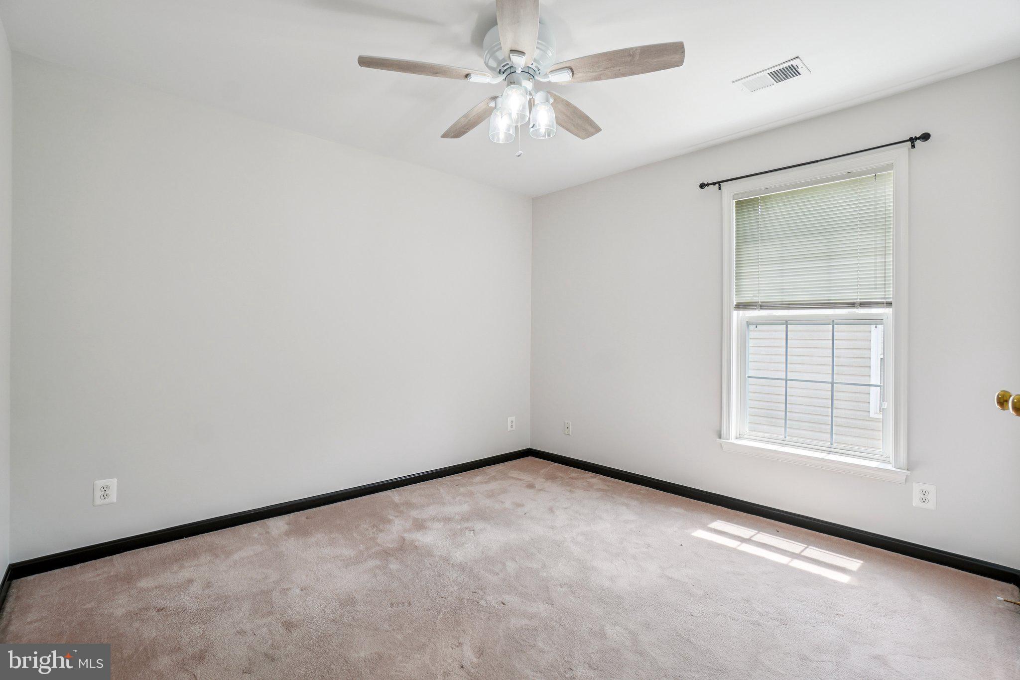 12513 Fox View Way Reston, VA 20191 - Photo 13 of 39 an empty room with windows and fan