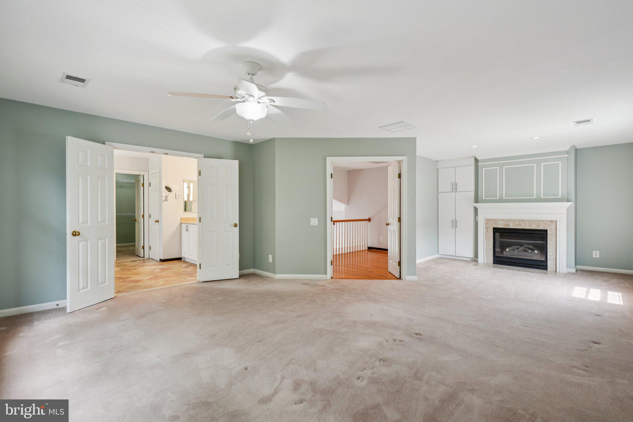 12513 Fox View Way Reston, VA 20191 - Photo 18 of 39 a view of empty room with a fireplace and fan