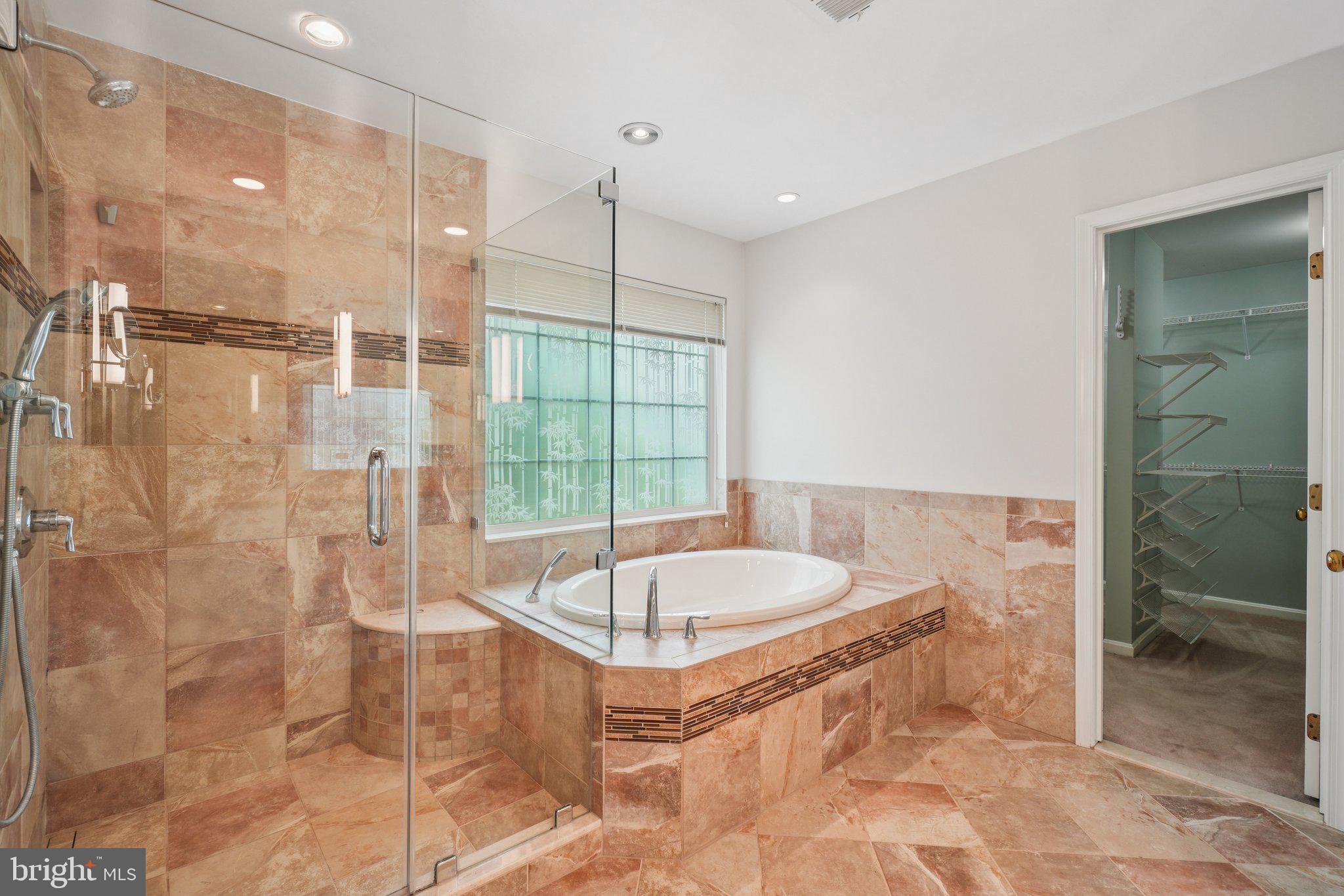 12513 Fox View Way Reston, VA 20191 - Photo 21 of 39 a bathroom with a tub and a shower