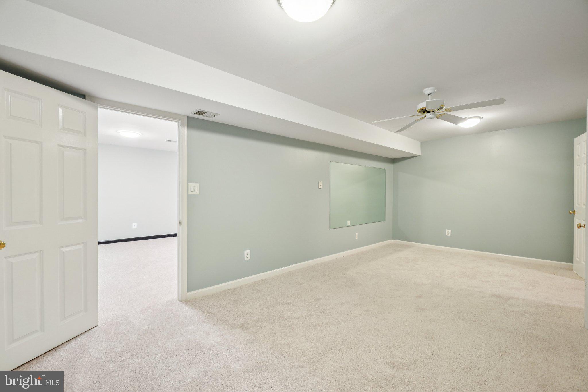 12513 Fox View Way Reston, VA 20191 - Photo 24 of 39 a view of an empty room with a ceiling fan