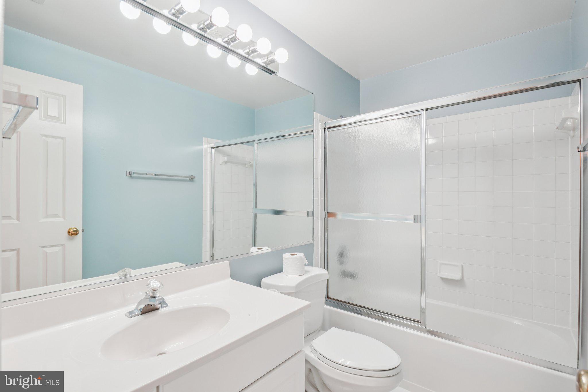 12513 Fox View Way Reston, VA 20191 - Photo 28 of 39 a bathroom with a sink a toilet and shower