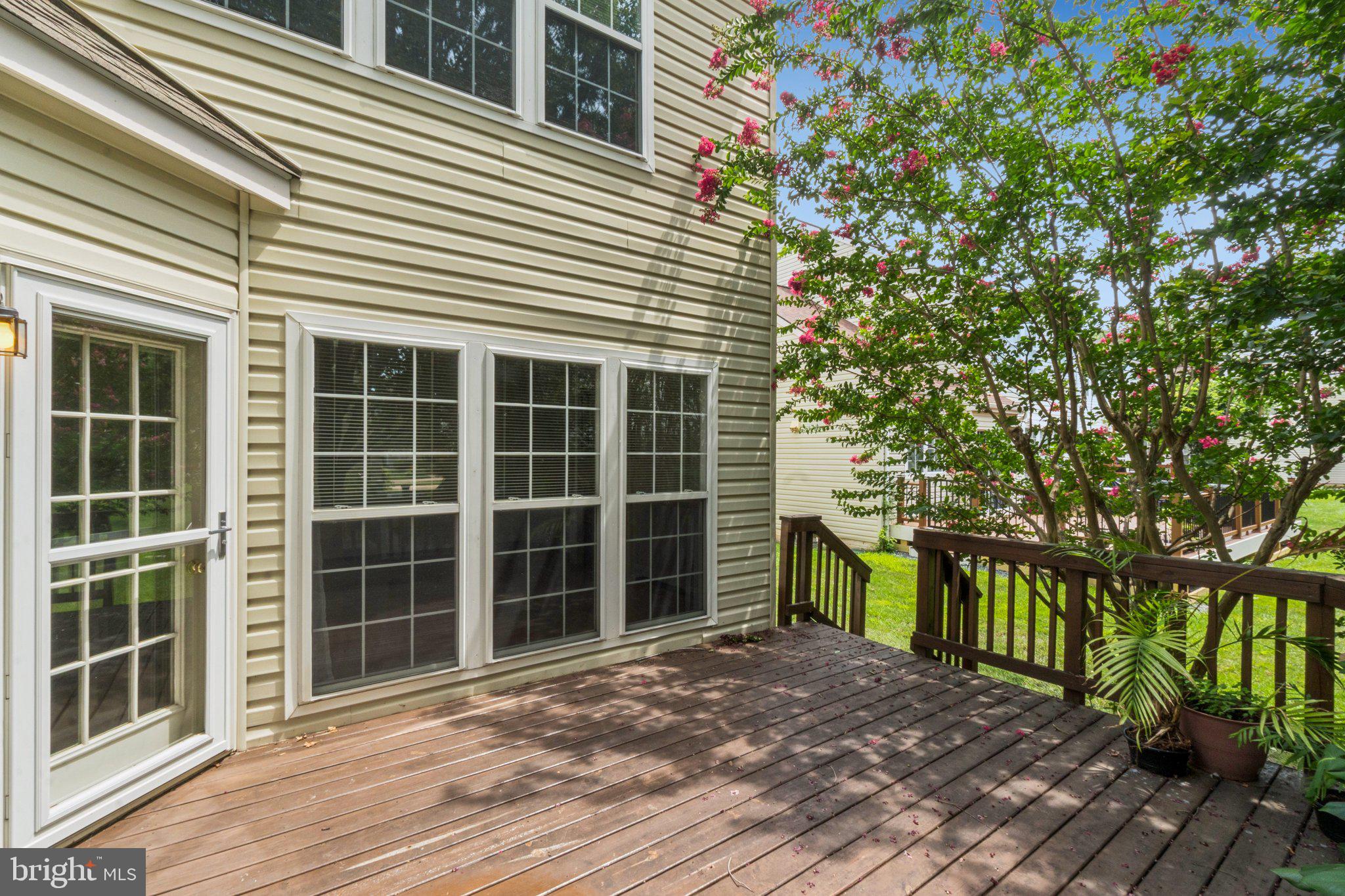 12513 Fox View Way Reston, VA 20191 - Photo 33 of 39 a view of a house with a large window and wooden fence