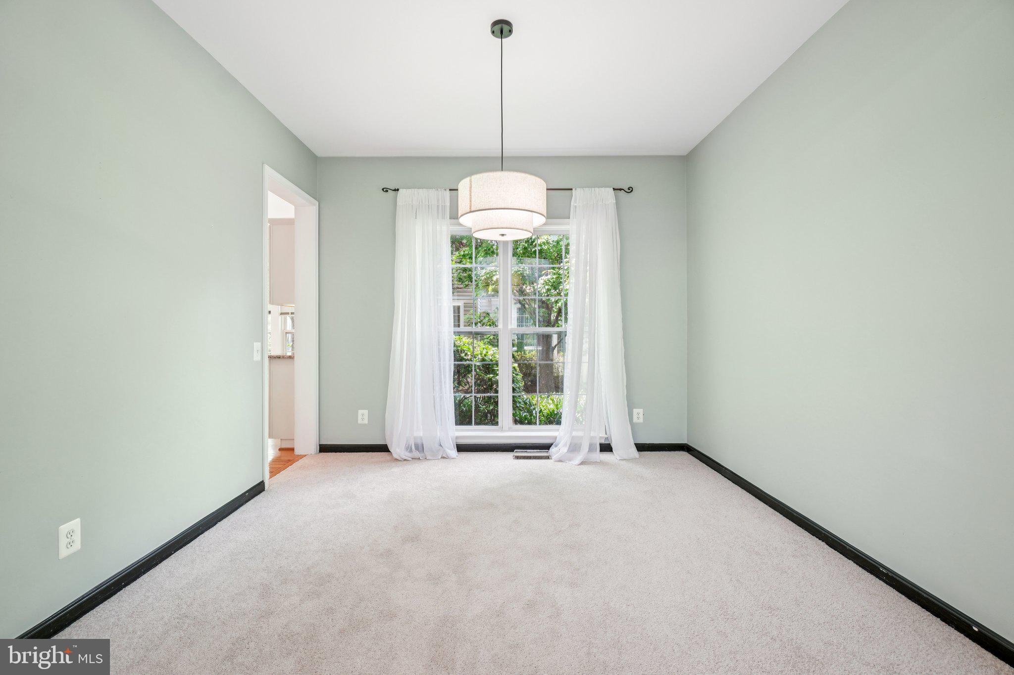 12513 Fox View Way Reston, VA 20191 - Photo 4 of 39 a view of an empty room with window and chandelier