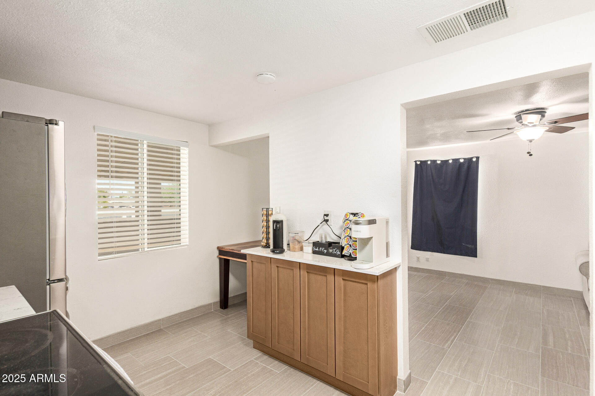 1221 East Alta Vista Road Phoenix, AZ 85042 - Photo 11 of 33 a room with furniture and window