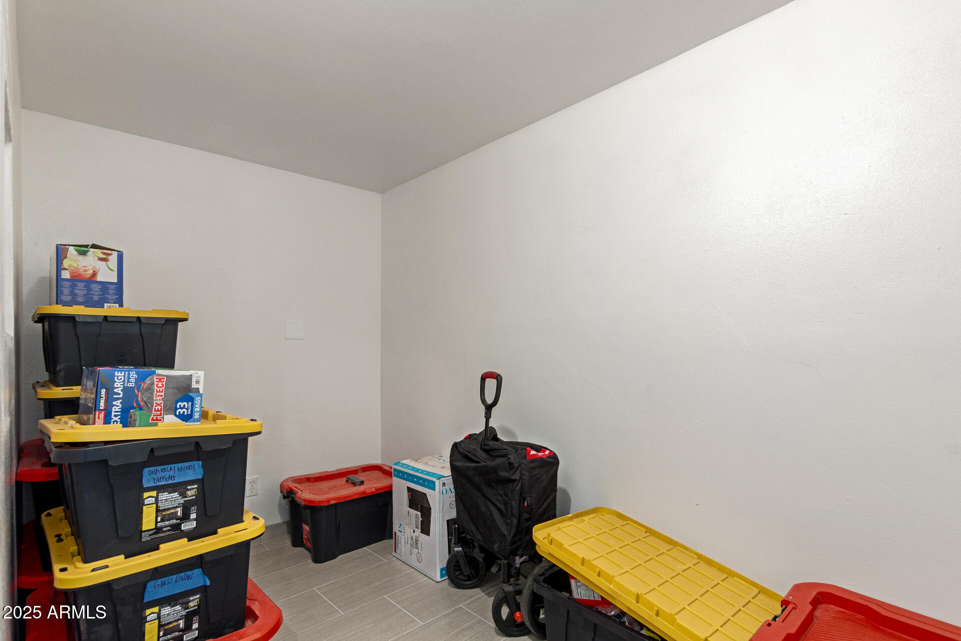 1221 East Alta Vista Road Phoenix, AZ 85042 - Photo 21 of 33 a room with toys and dresser
