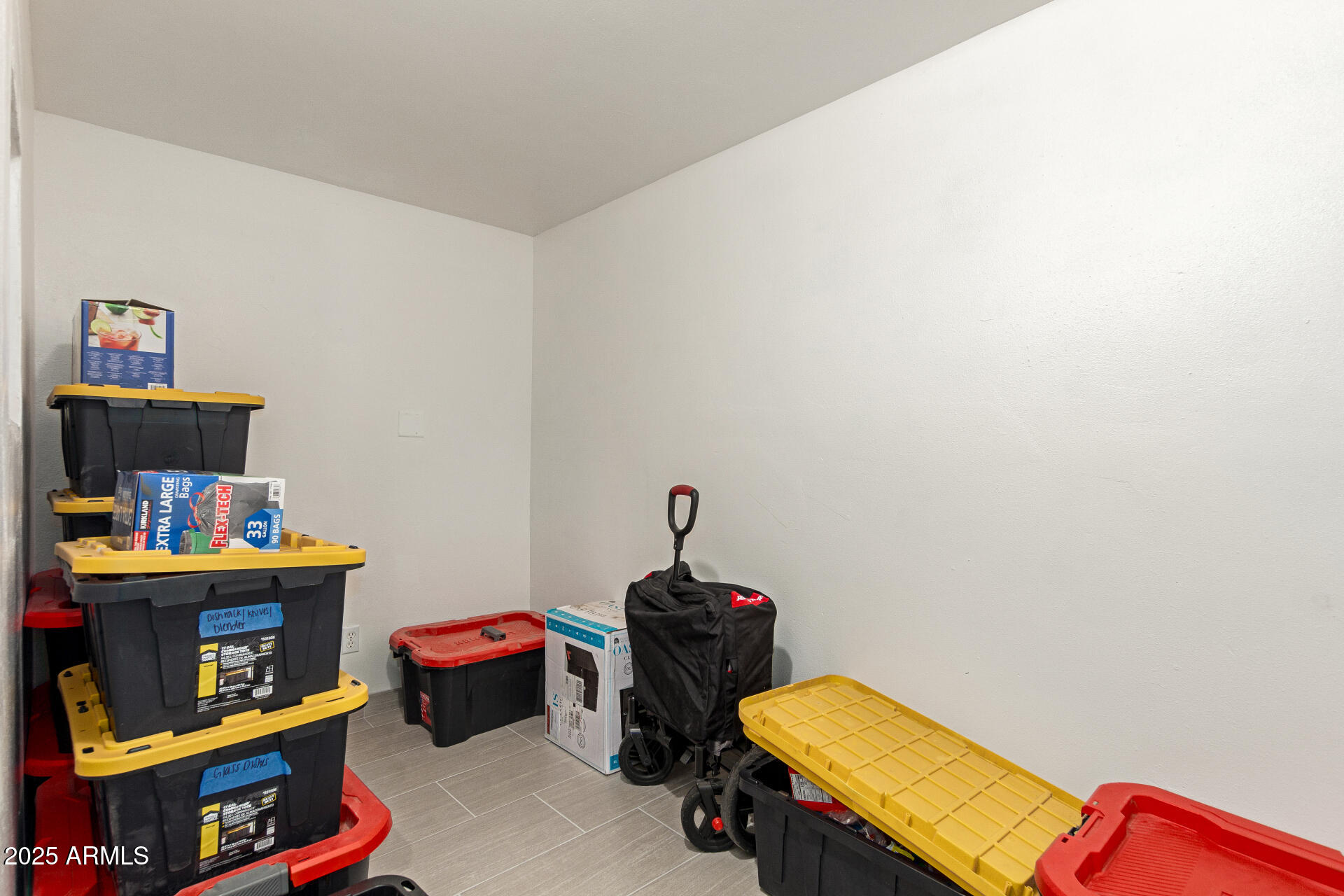 1221 East Alta Vista Road Phoenix, AZ 85042 - Photo 22 of 33 a room with toys and dresser